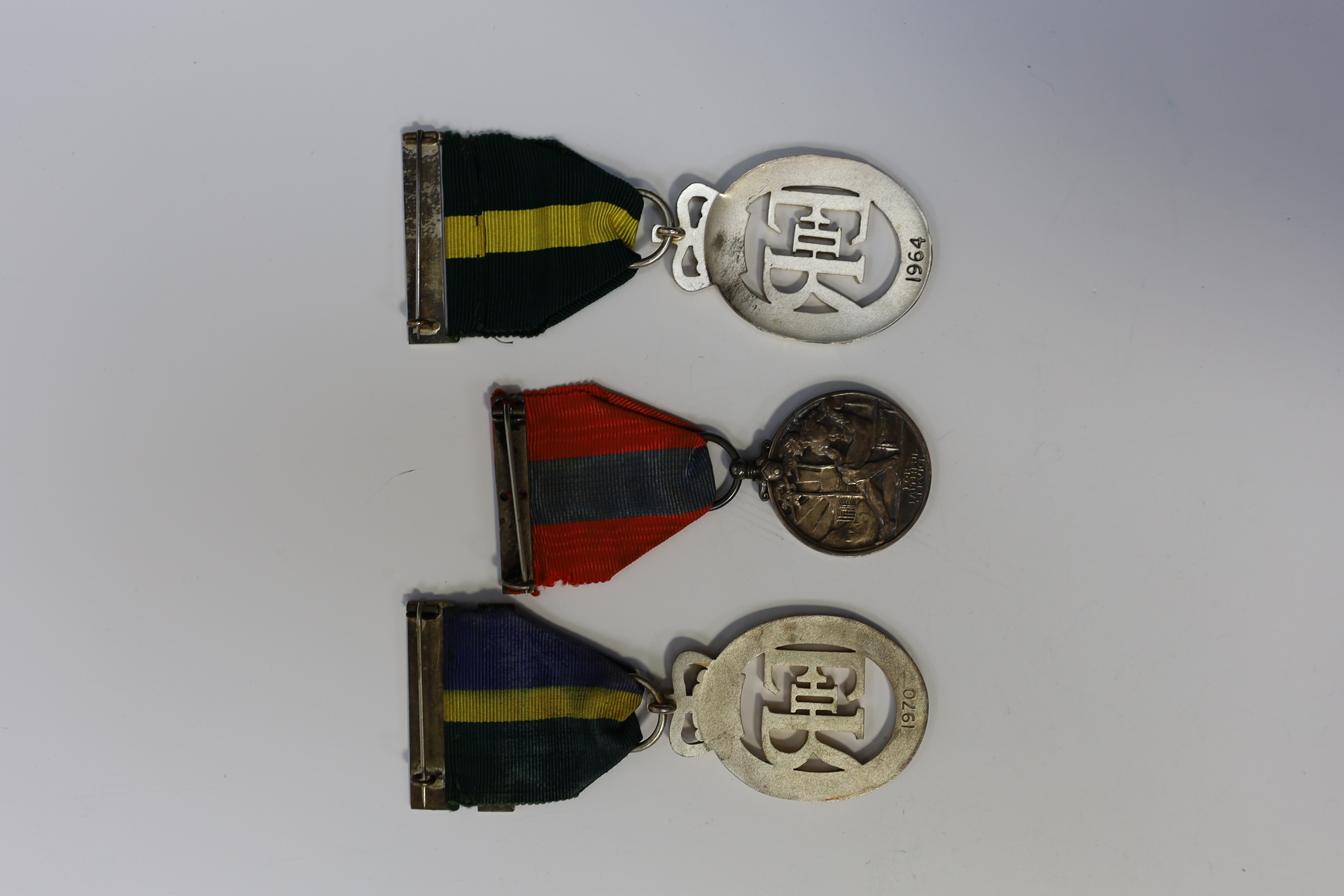 Three assorted service medals; Imperial Service medal to Henry Chillingworth; Territorial Efficiency Decoration 1964; T&A.V.R Efficiency Decoration 1970. All cased. Condition - good.